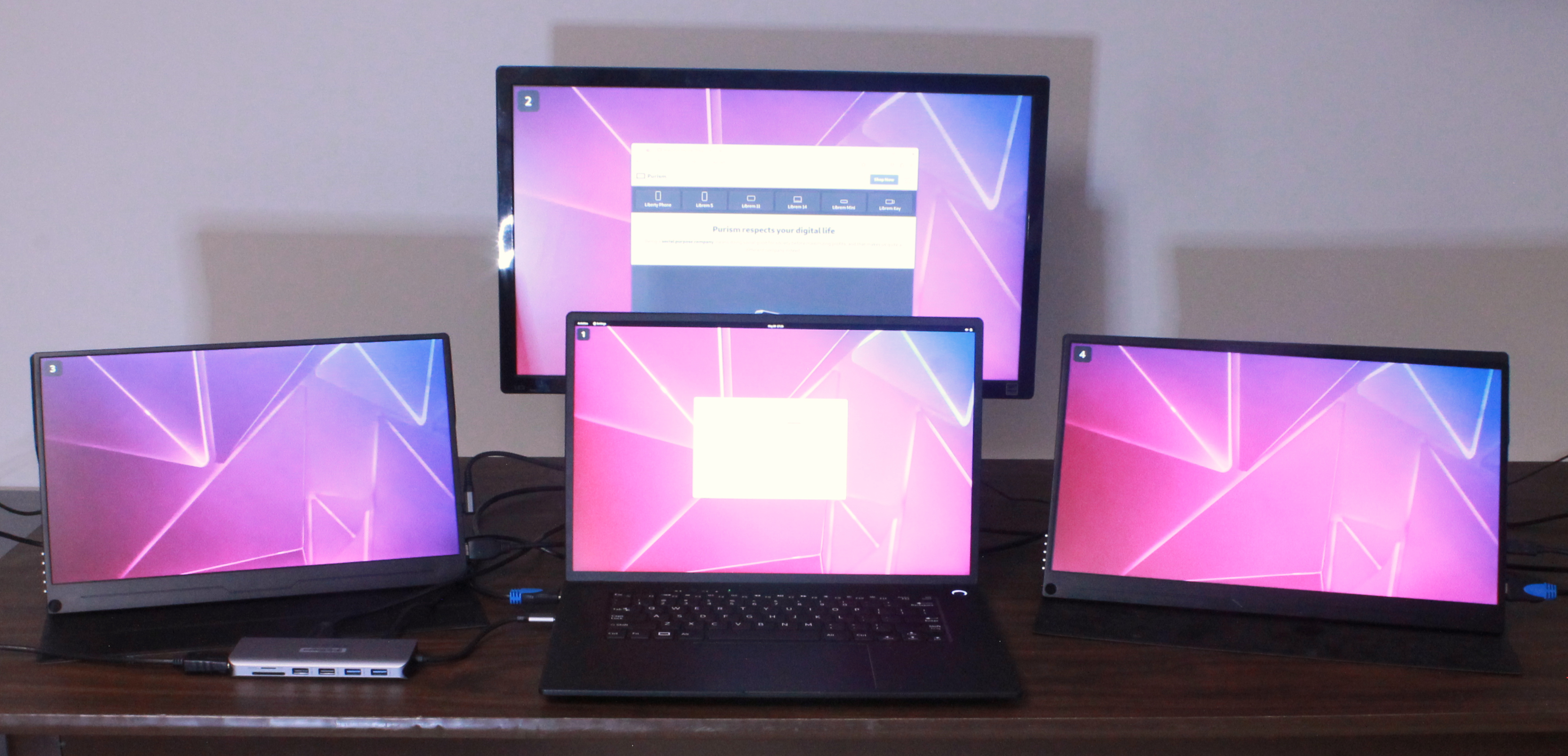 Librem 16 with its own display and three external displays active